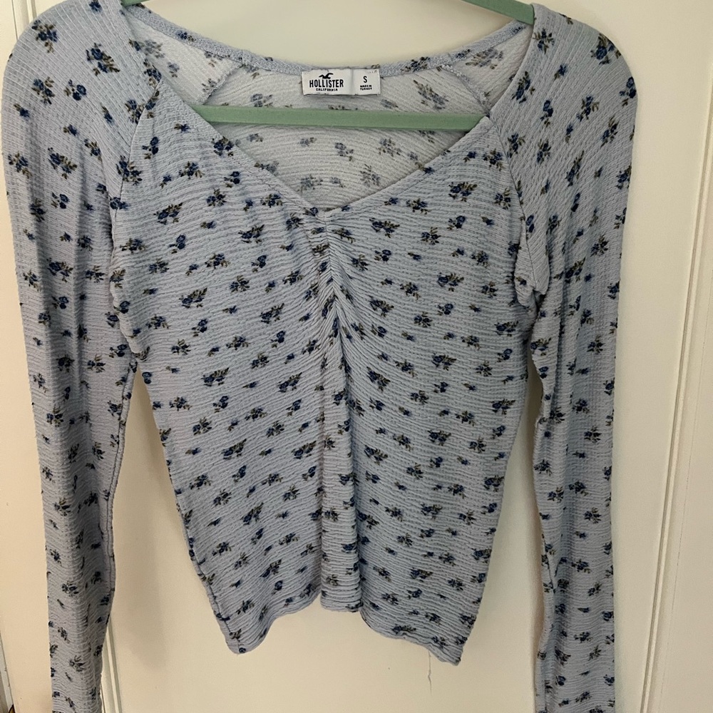 Hollister size small long sleeve top, fairly new, light blue floral pattern.